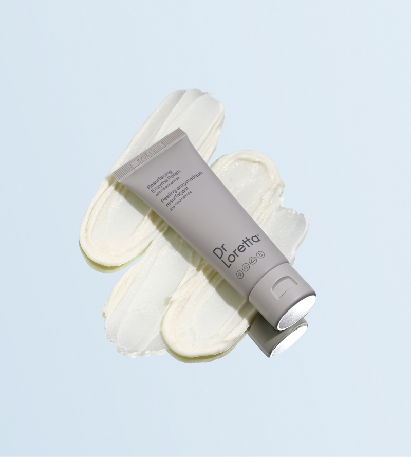 Resurfacing Enzyme Polish bottle on top of spread cream